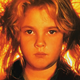 Drew Barrymore, striking an iconic pose in the 1984 version of Firestarter.